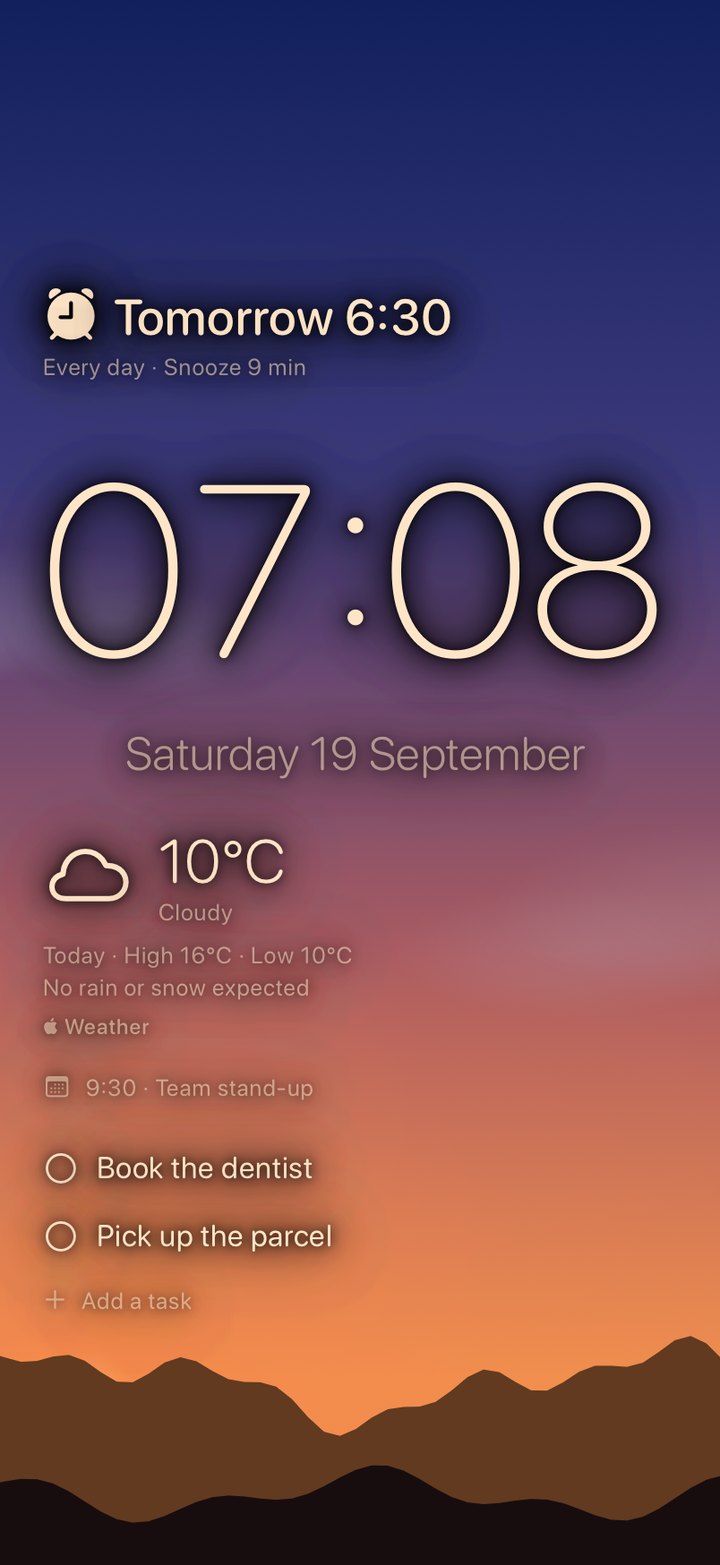 A sky at sunrise behind the clock, with hills along the bottom.